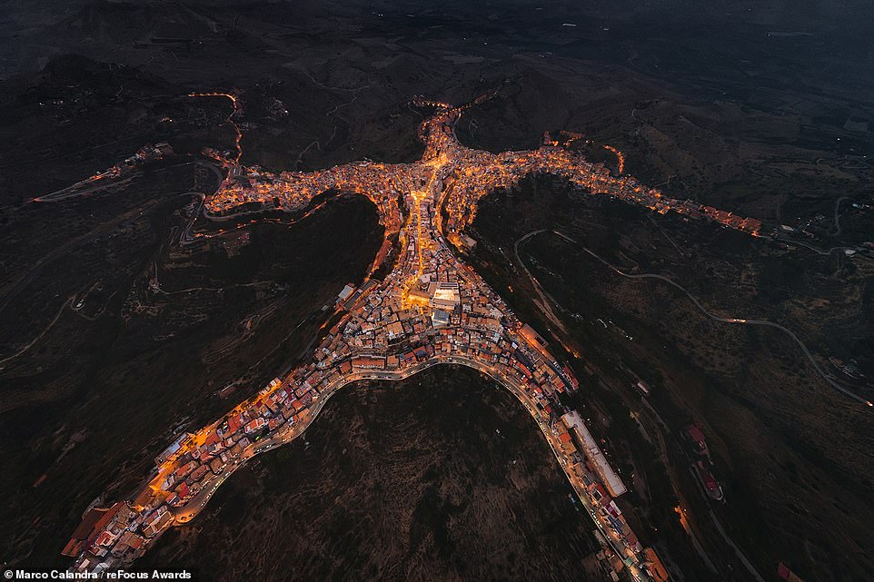 This extraordinary aerial shot shows Centuripe, a small town on the island of Sicily that bears an uncanny resemblance to the shape of a person. Taking the silver award in the 'Aerial' category for professional photographers, it's the work of photographer Marco Calandra, who gives the image the title of 'The Titan'