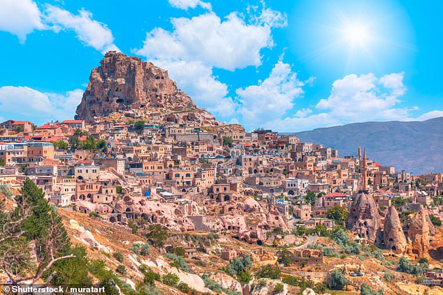 Cappadocia lies on a plateau north of Turkey's Taurus Mountains - but feels like another planet. Above is the ancient village of Uchisar in the region