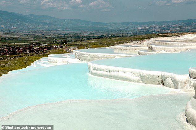 Pay a visit to Pamukkale, a town that's blessed with natural thermal waters that flow down glistening limestone terraces