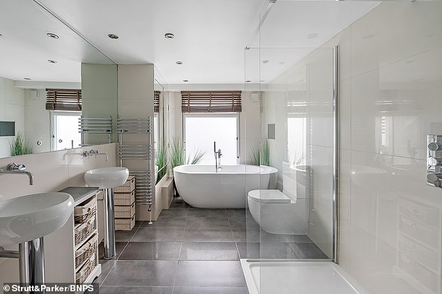 The property, decorated with modern muted colours, has two sleek bathrooms