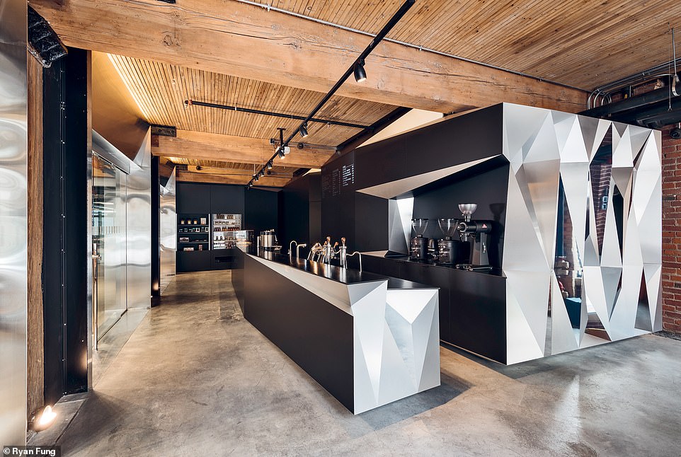 THOR ESPRESSO BAR, TORONTO: Schneider describes this award-winning design as 'very striking and impactful'. He adds: 'The main spatial element consists of faceted volumes consisting of brushed, tinted, and polished stainless steel along with super matte black acrylic surfaces. The volumes reflect light in different and unique ways depending on the season and time of day'