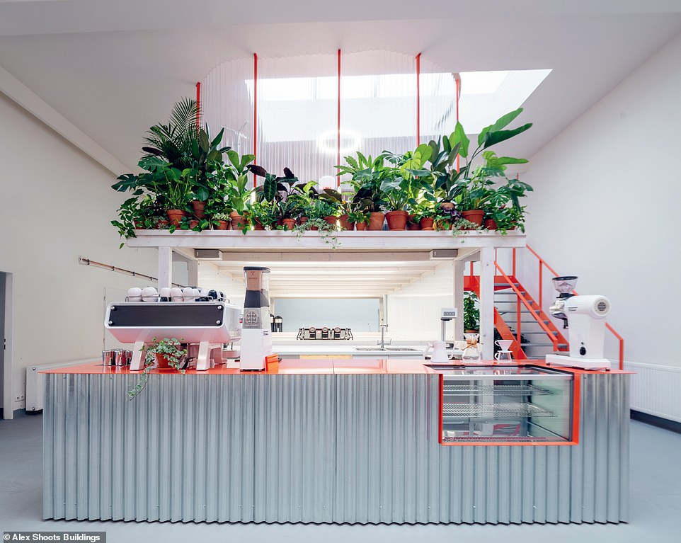 GROUNDS + RNRC ROASTERY, PRAGUE, CZECHIA: This 'vibrant' space was designed by KOGAA Studio, the author reveals. Its interior features 'a bright orange steel staircase', 'custom-made round concrete coffee tables', and four large skylights that 'allow abundant natural light into the space'. And it was all completed on a tight budget. Schneider reveals that 80 per cent of materials were 'obtained from construction waste while the suspended lights and industrial lamps were sourced from a closed factory'. Although challenging, the architect, Alexandra Georgescu, noted that '[working on a small budget] kept the design simple and needless of useless parts'