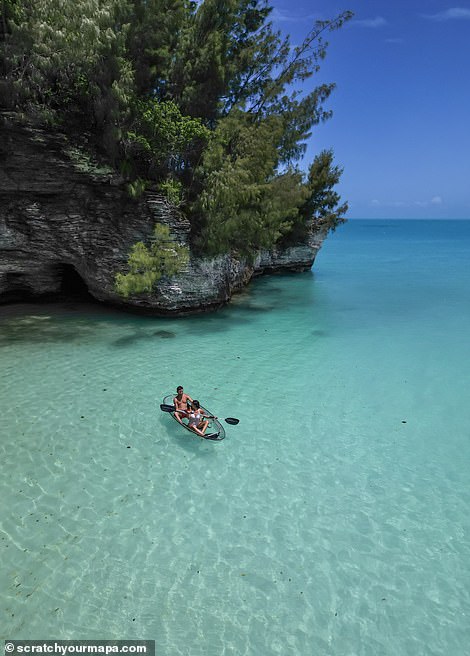 The pair are shown here in a transparent canoe enjoying the azure waters of Spanish Point, Bermuda