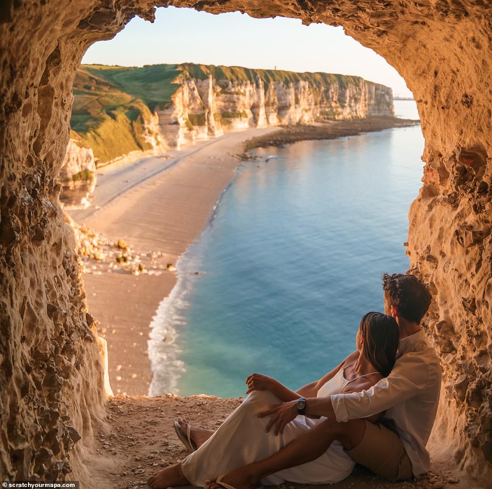 Globetrotting couple Danielle Zito and Fede Supital Terron have allowed MailOnline Travel to run 15 incredible photos from their adventures. They're pictured above looking out at the striking rock formations in Étretat, a town in Normandy, France
